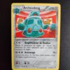 Archéodong 96/162. Carte du TCG Pokémon issue de la série Impulsion Turbo du bloc XY (XY08, XY: Impulsion Turbo), parue le 07/11/2015. Carte Pokémon de Niveau 1 de type Métal, évolution de d'Archéomire. Rare. Illustrateur: Tomokazu Komiya. L'illustration représente un gros robot vert exposé comme une pièce de musée.
