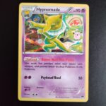 Hypnomade 51/122. Carte du TCG Pokémon issue de la série Rupture Turbo du bloc XY (XY09, XY: Rupture Turbo), parue le 06/02/2016. Carte Pokémon Niveau 1 de type Psy, évolution de Soporifik, Rare. Illustrateur: Tomokazu Komiya. L'illustration représente un tapir à collerette blanche dans un paysage déstructuré séparé en 2 parties oniriques.