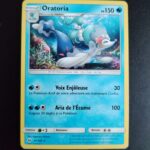 Oratoria 41/149. Carte du TCG Pokémon issue de la série Soleil et Lune du bloc Soleil et Lune (SL01, SL: Soleil et Lune), parue le 03/02/2017. Carte Pokémon de Niveau 2 de type Eau, évolution de Otarlette. Rare. Illustrateur: Kagemaru Himeno. L'illustration représente une otarie blanche et bleue au fond de l'océan. Cette créature est affublée de traits et d'accessoires de starlette de la chanson.