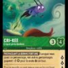 CRI-KEE Criquet porte-bonheur 69/204. Carte du jeu de cartes à collectionner Disney Lorcana issue du Chapitre 4 Le Retour D'Ursula (URR), paru le 31/05/2024. Carte Personnage, Emeraude. Rare. Illustrateur: Heidi Neunhoffer. L'illustration représente un criquet violet en train de bondir